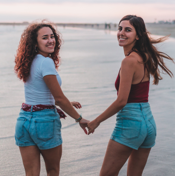 two girl holding hand